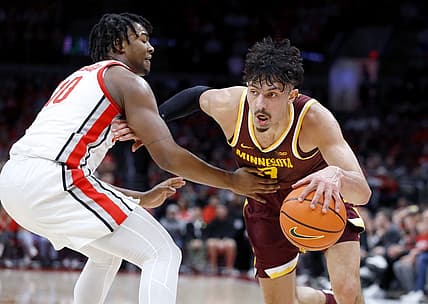 Jan 12, 2023; Columbus, Ohio, USA;  Minnesota Golden Gophers forward Dawson Garcia (3) dribbles past Ohio State Buckeyes forward Brice Sensabaugh (10) during the first half at Value City Arena. Mandatory Credit: Joseph Maiorana-USA TODAY Sports