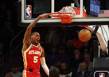 Feb 1, 2023; Phoenix, Arizona, USA; Atlanta Hawks guard Dejounte Murray (5) slam dunks the ball against the Phoenix Suns in the first half at Footprint Center. Mandatory Credit: Mark J. Rebilas-USA TODAY Sports