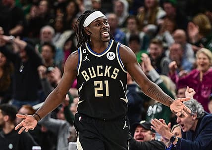 Feb 14, 2023; Milwaukee, Wisconsin, USA; Milwaukee Bucks guard Jrue Holiday (21) reacts after scoring a basket in the fourth quarter during game against the Boston Celtics at Fiserv Forum. Mandatory Credit: Benny Sieu-USA TODAY Sports
