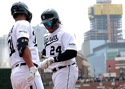 Detroit Tigers Miguel Cabrera shakes hands with teammate Riley Greene after scoring the Tigers first run during game action on Fiesta Tigres between the Detroit Tigers and the Tampa Bay Rays at Comerica Park in Detroit on Saturday, August 5, 2023.