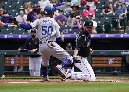 Apr 4, 2021; Denver, Colorado, USA; Los Angeles Dodgers right fielder Mookie Betts (50) scores on Colorado Rockies starting pitcher Austin Gomber (26) in the first inning at Coors Field. Mandatory Credit: Ron Chenoy-USA TODAY Sports