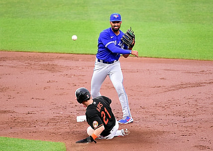 Jun 18, 2021; Baltimore, Maryland, USA; Toronto Blue Jays second baseman Marcus Semien (10) tries to turn a double play over Baltimore Orioles outfielder Austin Hays (21) in the third inning at Oriole Park at Camden Yards. Mandatory Credit: Evan Habeeb-USA TODAY Sports