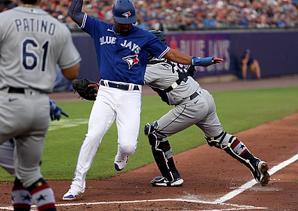 Jul 2, 2021; Buffalo, New York, USA;  Tampa Bay Rays catcher Francisco Mejia (28) misses the tag as Toronto Blue Jays second baseman Marcus Semien (10) is safe at home plate during the second inning at Sahlen Field. Mandatory Credit: Timothy T. Ludwig-USA TODAY Sports