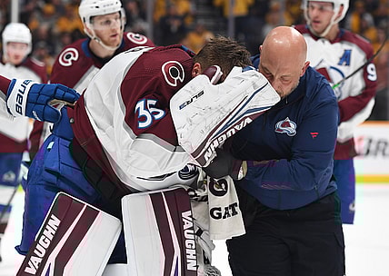 May 7, 2022; Nashville, Tennessee, USA; Colorado Avalanche goaltender Darcy Kuemper (35) is helped off the ice after an injury during the first period against the Nashville Predators in game three of the first round of the 2022 Stanley Cup Playoffs at Bridgestone Arena. Mandatory Credit: Christopher Hanewinckel-USA TODAY Sports