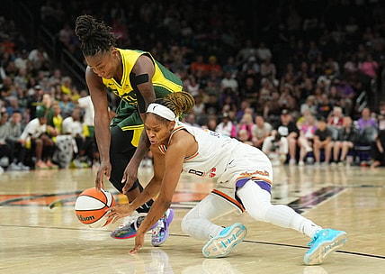 Aug 5, 2023; Phoenix, Arizona, USA; Seattle Storm guard Jewell Loyd (24) and Phoenix Mercury guard Moriah Jefferson (8) go after a loose ball during the second half at Footprint Center. Mandatory Credit: Joe Camporeale-USA TODAY Sports
