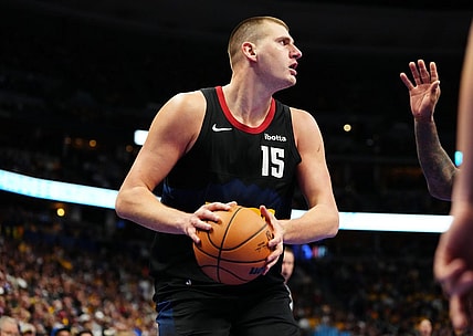 Nov 14, 2023; Denver, Colorado, USA; Denver Nuggets center Nikola Jokic (15) controls the ball in the second half against the LA Clippers at Ball Arena. Mandatory Credit: Ron Chenoy-USA TODAY Sports