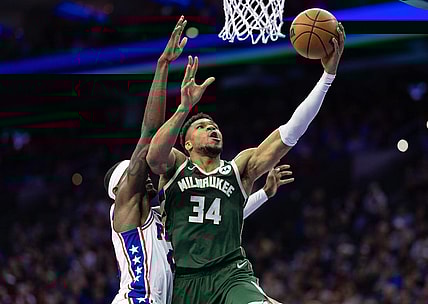 Feb 25, 2024; Philadelphia, Pennsylvania, USA; Milwaukee Bucks forward Giannis Antetokounmpo (34) drives for a score past Philadelphia 76ers forward Paul Reed (44) during the second quarter at Wells Fargo Center. Mandatory Credit: Bill Streicher-USA TODAY Sports