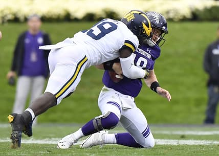 Sep 29, 2018; Evanston, IL, USA; Michigan Wolverines defender Kwity Paye (left) sacks Northwestern Wildcats quarterback Clayton Thorson (right) in the first half at Ryan Field. Mandatory Credit: Quinn Harris-USA TODAY Sports