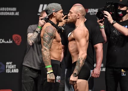 Jan 22, 2021; Abu Dhabi, UNITED ARAB EMIRATES;   Dustin Poirier and Conor McGregor of Ireland face off during the UFC 257 weigh-in at Etihad Arena on UFC Fight Island on January 22, 2021 in Abu Dhabi, United Arab Emirates. Mandatory Credit: Jeff Bottari/Handout Photo via USA TODAY Sports