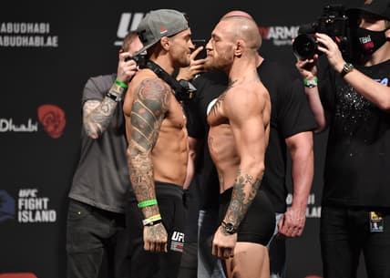 Jan 22, 2021; Abu Dhabi, UNITED ARAB EMIRATES;   Dustin Poirier and Conor McGregor of Ireland face off during the UFC 257 weigh-in at Etihad Arena on UFC Fight Island on January 22, 2021 in Abu Dhabi, United Arab Emirates. Mandatory Credit: Jeff Bottari/Handout Photo via USA TODAY Sports
