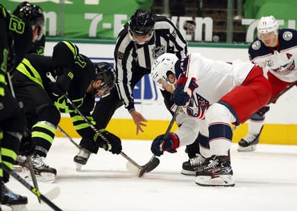 Apr 17, 2021; Dallas, Texas, USA; Dallas Stars center Andrew Cogliano (11) and Columbus Blue Jackets center Jack Roslovic (96) in a face off in the second period  at American Airlines Center. Mandatory Credit: Tim Heitman-USA TODAY Sports