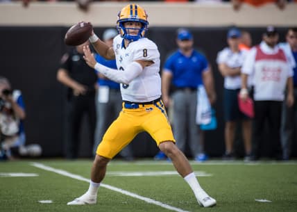 Sep 7, 2019; Stillwater, OK, USA; McNeese State Cowboys quarterback Cody Orgeron (8) drops back to pass against the Oklahoma State Cowboys during the first quarter at Boone Pickens Stadium. Mandatory Credit: Rob Ferguson-USA TODAY Sports
