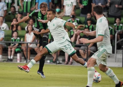 Jul 31, 2021; Austin, TX, USA; Austin FC midfielder Tom  s Pochettino (7) shoots on goal through Colorado Rapids defender Steven Beitashour (33) in the second half at Q2 Stadium. Mandatory Credit: Scott Wachter-USA TODAY Sports