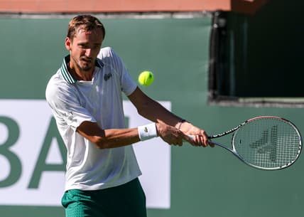 Daniil Medvedev of Russia returns to Grigor Dimitrov of Bulgaria during their round four match of the BNP Paribas Open, Wednesday, Oct. 13, 2021, in Indian Wells, Calif.