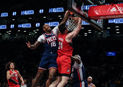 Mar 18, 2022; Brooklyn, New York, USA; Portland Trail Blazers forward Drew Eubanks (24) dunks as Brooklyn Nets forward James Johnson (16) defends during the first half at Barclays Center. Mandatory Credit: Vincent Carchietta-USA TODAY Sports