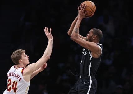Apr 12, 2022; Brooklyn, New York, USA; Brooklyn Nets forward Kevin Durant (7) shoots the ball over Cleveland Cavaliers forward Lauri Markkanen (24) during the first half at Barclays Center. Mandatory Credit: Vincent Carchietta-USA TODAY Sports