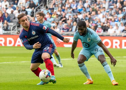 Apr 23, 2022; Saint Paul, Minnesota, USA; Minnesota United defender Kemar Lawrence (92) and Chicago Fire midfielder Xherdan Shaqiri (10) play the ball in the first half at Allianz Field. Mandatory Credit: Matt Blewett-USA TODAY Sports