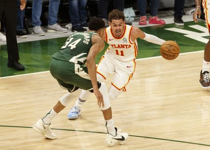 Jun 23, 2021; Milwaukee, Wisconsin, USA;  Atlanta Hawks guard Trae Young (11) drives for the basket against Milwaukee Bucks forward Giannis Antetokounmpo (34) during the fourth quarter during game one of the Eastern Conference Finals for the 2021 NBA Playoffs at Fiserv Forum. Mandatory Credit: Jeff Hanisch-USA TODAY Sports