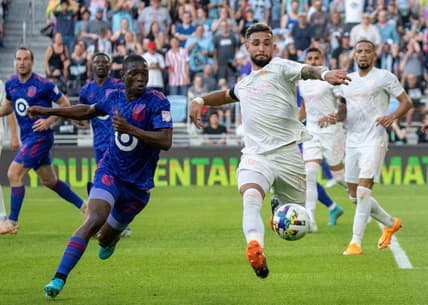 May 28, 2022; Saint Paul, Minnesota, USA; New York City midfielder Valentin Castellanos (11) and Minnesota United forward Bongokuhle Hlongwane (21) chase the ball at Allianz Field. Mandatory Credit: Matt Blewett-USA TODAY Sports
