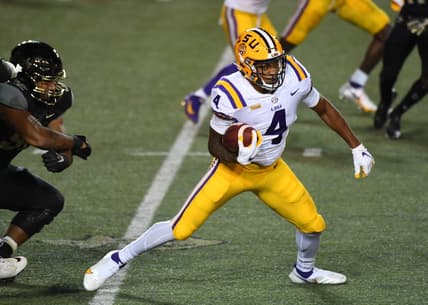 Oct 3, 2020; Nashville, Tennessee, USA; LSU Tigers running back John Emery Jr. (4) runs for a first down during the first half against the Vanderbilt Commodores at Vanderbilt Stadium. Mandatory Credit: Christopher Hanewinckel-USA TODAY Sports