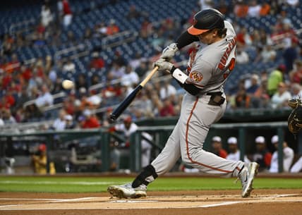 Sep 13, 2022; Washington, District of Columbia, USA; Baltimore Orioles catcher Adley Rutschman (35) hits a single against the Washington Nationals during the first inning at Nationals Park. Mandatory Credit: Brad Mills-USA TODAY Sports