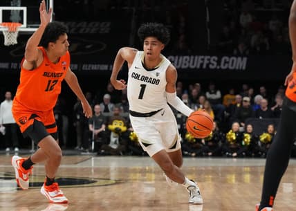 Jan 7, 2023; Boulder, Colorado, USA; Colorado Buffaloes guard Julian Hammond III (1) dribbles past Oregon State Beavers forward Michael Rataj (12) in the first half at CU Events Center. Mandatory Credit: Ron Chenoy-USA TODAY Sports
