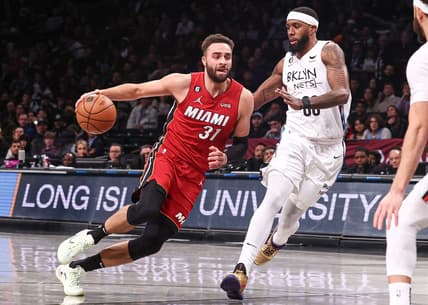 Feb 15, 2023; Brooklyn, New York, USA; Miami Heat guard Max Strus (31) shoots the ball against Brooklyn Nets forward Royce O'Neale (00) during the first half at Barclays Center. Mandatory Credit: Vincent Carchietta-USA TODAY Sports
