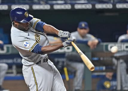May 18, 2021; Kansas City, Missouri, USA; Milwaukee Brewers center fielder Lorenzo Cain (6) singles during the ninth inning against the Kansas City Royals at Kauffman Stadium. Mandatory Credit: Peter Aiken-USA TODAY Sports
