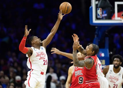 Mar 20, 2023; Philadelphia, Pennsylvania, USA; Philadelphia 76ers forward Danuel House Jr. (25) tips the ball past Chicago Bulls forward DeMar DeRozan (11) during the second quarter at Wells Fargo Center. Mandatory Credit: Bill Streicher-USA TODAY Sports