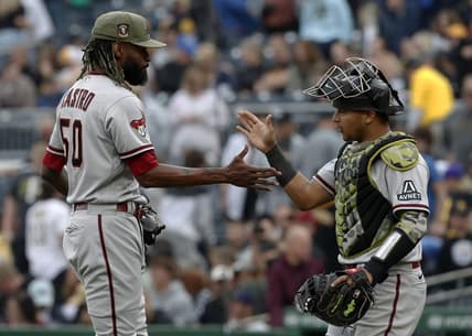May 20, 2023; Pittsburgh, Pennsylvania, USA;  Arizona Diamondbacks relief pitcher Miguel Castro (50) and catcher Gabriel Moreno (14) shake hands after defeating the Pittsburgh Pirates during at PNC Park.The Diamondbacks won 4-3.  Mandatory Credit: Charles LeClaire-USA TODAY Sports