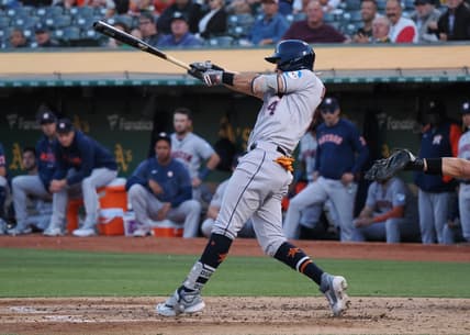 Jul 20, 2023; Oakland, California, USA; Houston Astros second baseman Mauricio Dubon (14) hits a single against the Oakland Athletics during the sixth inning at Oakland-Alameda County Coliseum. Mandatory Credit: Kelley L Cox-USA TODAY Sports