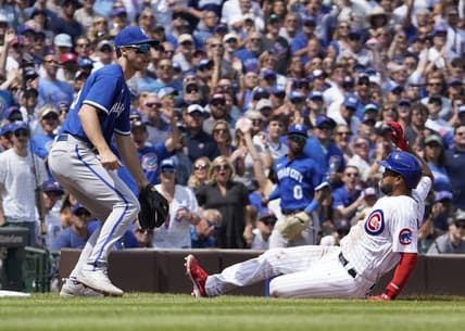 Aug 19, 2023; Chicago, Illinois, USA; Chicago Cubs third baseman Jeimer Candelario (9) is safe at third base with a triple as Kansas City Royals third baseman Matt Duffy (15) waits for  throw during the second inning at Wrigley Field. Mandatory Credit: David Banks-USA TODAY Sports