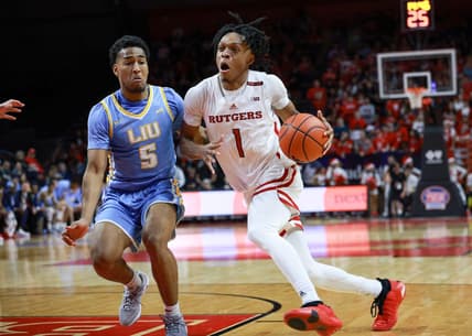Dec 16, 2023; Piscataway, New Jersey, USA; Rutgers Scarlet Knights guard Jamichael Davis (1) drives to the basket as Long Island Sharks guard Andre Washington (5) defends during the second half at Jersey Mike's Arena. Mandatory Credit: Vincent Carchietta-USA TODAY Sports