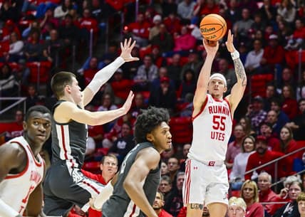 Dec 29, 2023; Salt Lake City, Utah, USA; Utah Utes guard Gabe Madsen (55) takes a three point shot over Washington State Cougars forward Andrej Jakimovski (23) during the second half at the Jon M. Huntsman Center. Mandatory Credit: Christopher Creveling-USA TODAY Sports
