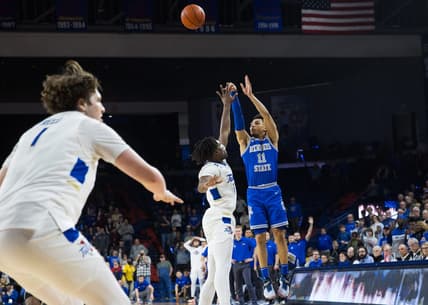 Jan 4, 2024; Tulsa, Oklahoma, USA; Memphis Tigers guard Jahvon Quinerly (11) hits a three point shot over Tulsa Golden Hurricane forward Carlous Williams (12) for the go ahead and eventual game winner against the Tulsa Golden Hurricane at Reynolds Center. The Memphis Tigers won the game 78-75. Mandatory Credit: Brett Rojo-USA TODAY Sports