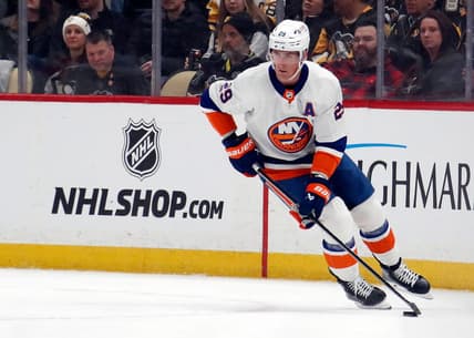 Feb 20, 2024; Pittsburgh, Pennsylvania, USA;  New York Islanders center Brock Nelson (29) moves the puck against the Pittsburgh Penguins during the first period at PPG Paints Arena. Mandatory Credit: Charles LeClaire-USA TODAY Sports