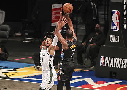 Jun 7, 2021; Brooklyn, New York, USA; Milwaukee Bucks forward Giannis Antetokounmpo (34) tries to block a shot taken by Brooklyn Nets forward Kevin Durant (7) in the first quarter during game two in the second round of the 2021 NBA Playoffs. at Barclays Center. Mandatory Credit: Wendell Cruz-USA TODAY Sports