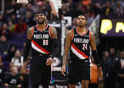 Dec 16, 2019; Phoenix, AZ, USA; Portland Trail Blazers forward Carmelo Anthony (00) and guard Kent Bazemore (24) against the Phoenix Suns at Talking Stick Resort Arena. Mandatory Credit: Mark J. Rebilas-USA TODAY Sports