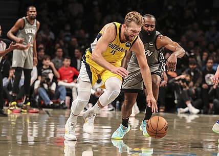 Oct 29, 2021; Brooklyn, New York, USA; Indiana Pacers forward Domantas Sabonis (11) and Brooklyn Nets guard James Harden (13) go after a loose ball in the second quarter at Barclays Center. Mandatory Credit: Wendell Cruz-USA TODAY Sports