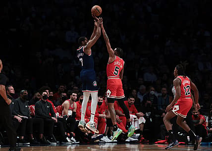 Dec 4, 2021; Brooklyn, New York, USA; Brooklyn Nets forward Kevin Durant (7) shoots the ball over Chicago Bulls forward Derrick Jones Jr. (5) during the first half at Barclays Center. Mandatory Credit: Vincent Carchietta-USA TODAY Sports