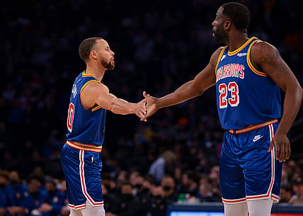 Dec 14, 2021; New York, New York, USA; Golden State Warriors guard Stephen Curry (30) slaps hands with forward Draymond Green (23) during the first half against the New York Knicks at Madison Square Garden. Mandatory Credit: Vincent Carchietta-USA TODAY Sports