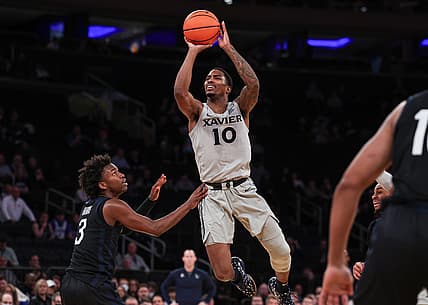 Mar 9, 2022; New York, NY, USA; Xavier Musketeers guard Nate Johnson (10) shoots the ball as Butler Bulldogs guard Chuck Harris (3) defends during the first half during the Big East Conference Tournament at Madison Square Garden. Mandatory Credit: Vincent Carchietta-USA TODAY Sports