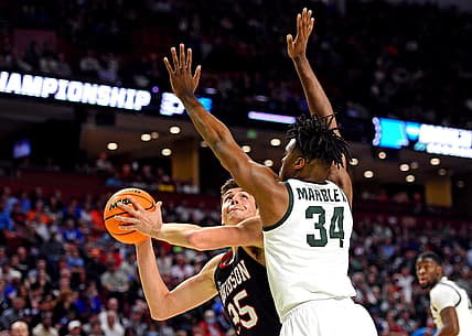 Mar 18, 2022; Greenville, SC, USA; Davidson Wildcats forward Luka Brajkovic (35) shoots the ball against Michigan State Spartans forward Julius Marble II (34) during the first round of the 2022 NCAA Tournament at Bon Secours Wellness Arena. Mandatory Credit: Bob Donnan-USA TODAY Sports