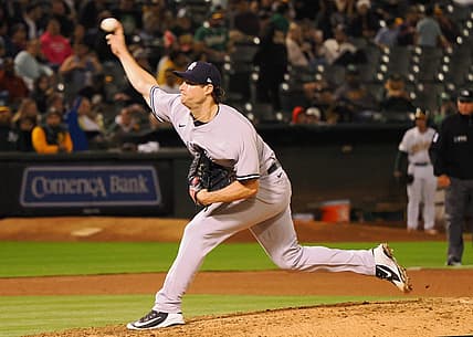 Aug 26, 2022; Oakland, California, USA; New York Yankees starting pitcher Gerrit Cole (45) throws a pitch against the Oakland Athletics during the seventh inning at RingCentral Coliseum. Mandatory Credit: Kelley L Cox-USA TODAY Sports