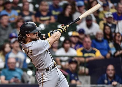 Aug 30, 2022; Milwaukee, Wisconsin, USA; Pittsburgh Pirates first baseman Michael Chavis (2) hits a solo home run in the seventh inning against the Milwaukee Brewers at American Family Field. Mandatory Credit: Benny Sieu-USA TODAY Sports
