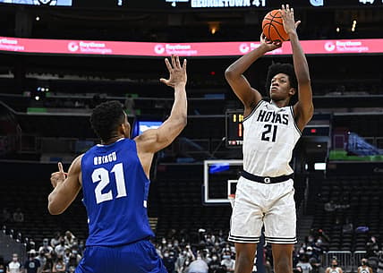 Feb 1, 2022; Washington, District of Columbia, USA; Georgetown Hoyas center Ryan Mutombo (21) shoots as Seton Hall Pirates center Ike Obiagu (21) during the second half at Capital One Arena. Mandatory Credit: Brad Mills-USA TODAY Sports