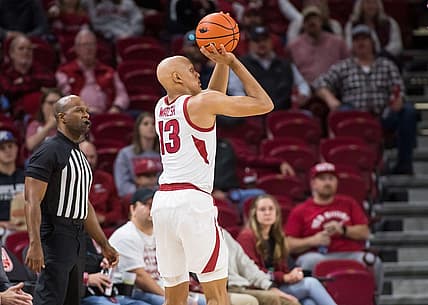 Dec 6, 2022; Fayetteville, Arkansas, USA;  Arkansas Razorbacks guard Jordan Walsh (13) shoots the ball during the first half against the UNC-Greensboro Spartans at Bud Walton Arena. Mandatory Credit: Brett Rojo-USA TODAY Sports