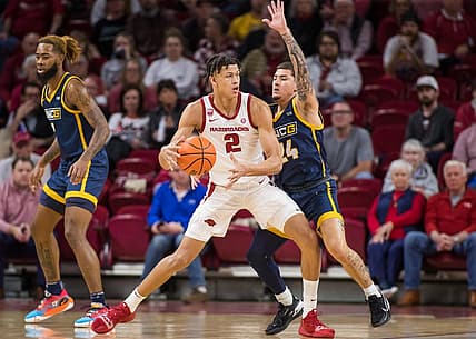 Dec 6, 2022; Fayetteville, Arkansas, USA;  Arkansas Razorbacks forward Trevon Brazile (2) tries to get around UNC-Greensboro Spartans guard Dante Treacy (24) during the first half at Bud Walton Arena. Mandatory Credit: Brett Rojo-USA TODAY Sports