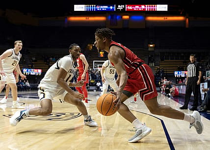 Dec 29, 2022; Berkeley, California, USA; Utah Utes guard Wilguens Jr. Exacte (11) drives the baseline past California Golden Bears forward Grant Newell (14) during the first half at Haas Pavilion. Mandatory Credit: D. Ross Cameron-USA TODAY Sports