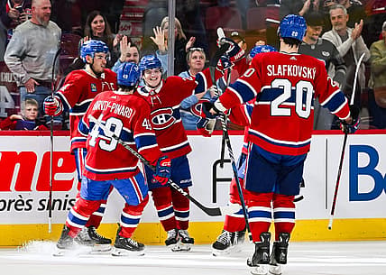 Oct 21, 2023; Montreal, Quebec, CAN; Montreal Canadiens right wing Cole Caufield (22) celebrates his winning goal against the Washington Capitals with his teammates during overtime at Bell Centre. Mandatory Credit: David Kirouac-USA TODAY Sports